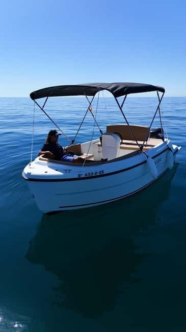 Benalmádena: license-Free Rent Boat for Dolphin Watching - Comfort onboard: solarium, sunshade, fridge, and tunes
