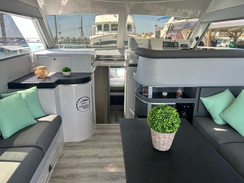Fuengirola: Dolphin Spotting Tour - Life on the Yacht: sun deck, shade, and Bluetooth for your playlist