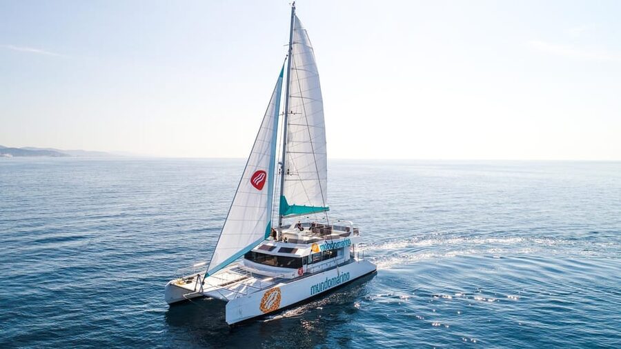 Malaga: Catamaran Sailing Cruise with Swimming & Optional DJ - The nets are the star: how to grab the best spot and stay comfortable