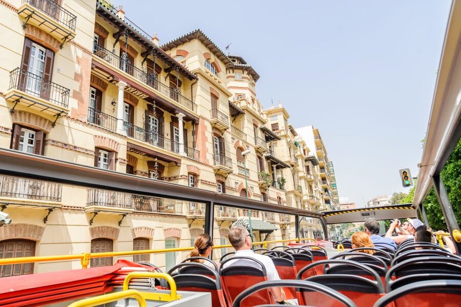 Malaga: City Sightseeing Hop-On Hop-Off Bus Tour - Green Route: minibus neighborhoods and gardens, but no audio