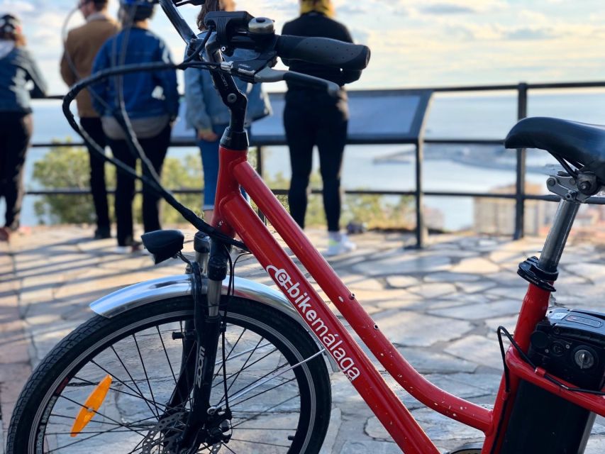 Malaga: Guided E-Bike Tour - Down past Alcazaba walls and along the promenade: beaches without the drag