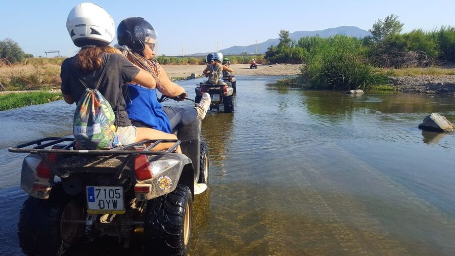 Málaga: Off-Road 2-Seater Quad Tour through Land and River - Entering Málaga by quad: where nature meets real-world noise